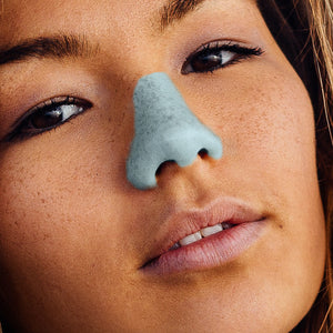 Woman wearing blue shade of NOZ Nozscreen.